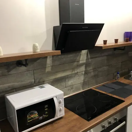 стильный лофт в аркадии - спальня и кухня-студия боковой вид моря! Apartment