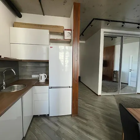 стильный лофт в аркадии - спальня и кухня-студия с боковым видом на море! Apartment *