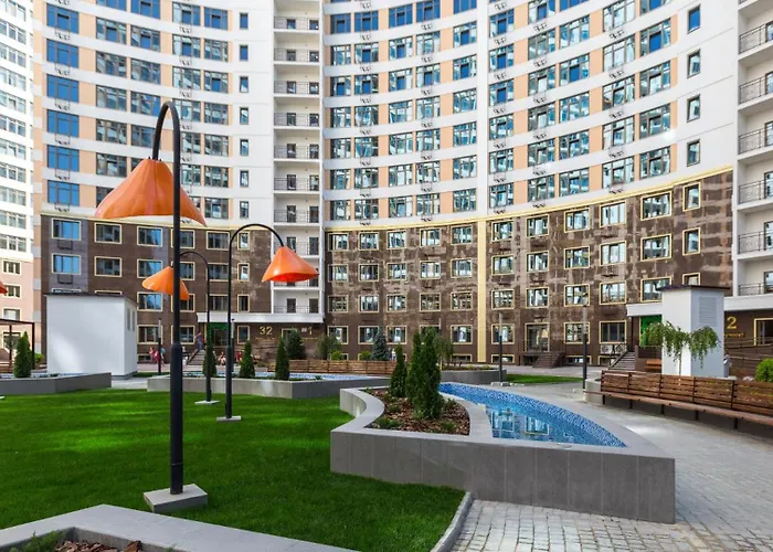 стильный лофт в аркадии - спальня и кухня-студия с боковым видом на море Apartman