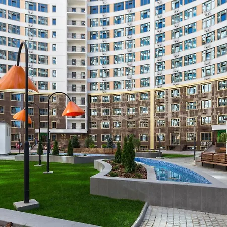 стильный лофт в аркадии - спальня и кухня-студия с боковым видом на море Апартаменты