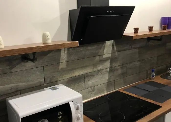 стильный лофт в аркадии - спальня и кухня-студия с боковым видом на море Апартаменты